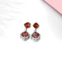 full view of sugar loaf hessonite garnet dangle earrings in rhodium over sterling silver