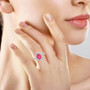 mahenge pink spinel and diamond halo ring in 950 platinum worn on a hand