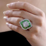 moissanite and green enamel ring in rhodium over sterling silver worn on a hand