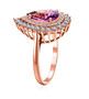 side view of purple sapphire and diamond halo ring in 18k rose gold
