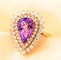purple sapphire and diamond halo ring in 18k rose gold shown in a lifestyle photo