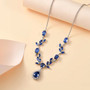 kyanite and white zircon necklace in rhodium over sterling silver shown in a lifestyle photo