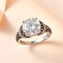 moissanite and green sapphire ring in rhodium over sterling silver shown in a lifestyle photo