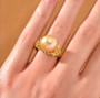 golden south sea pearl yellow sapphire and zircon ring in 18k yellow gold over sterling silver worn on a hand