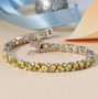 heliodor and moissanite tennis bracelet in rhodium over sterling silver shown in a lifestyle photo