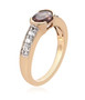 side view of color change garnet and zircon band ring in 18k yellow gold over sterling silver