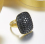 angled view of black spinel cluster ring in 14k yellow gold over sterling silver