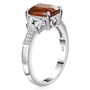 side view of orange kyanite and white zircon ring in rhodium over sterling silver