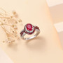ruby (ff) and white zircon double halo ring in rhodium over sterling silver shown in a lifestyle photo