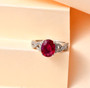 ruby (ff) and white zircon ring in rhodium over sterling silver shown in a lifestyle photo