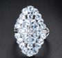 close up of sky blue topaz cluster ring in rhodium over sterling silver