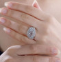 morganite blue apatite and moissanite flower cluster ring in rhodium over sterling silver worn on a hand