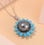 tahitian pearl and turquoise halo pendant necklace in rhodium over sterling silver shown in a lifestyle photo
