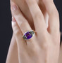 amethyst chrome diopside and moissanite ring in 18k yellow gold over sterling silver worn on a hand