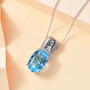 sky blue topaz and white zircon pendant necklace in rhodium over sterling silver shown in a lifestyle photo