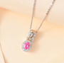 mahenge pink spinel and white zircon pendant necklace in 18k yellow gold and rhodium over sterling silver shown in a lifestyle photo