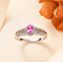 mahenge pink spinel and white zircon ring in 18k yellow gold and rhodium over sterling silver shown in a lifestyle photo