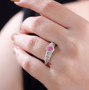 mahenge pink spinel and white zircon ring in 18k yellow gold and rhodium over sterling silver worn on a hand