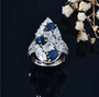 star sapphire moonstone and zircon cluster ring in rhodium over sterling silver shown in a lifestyle photo