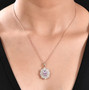 kunzite and moissanite pendant necklace in 18k rose gold over sterling silver worn around the neck