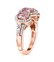 side view of pink spinel and white zircon trilogy halo ring in 18k rose gold over sterling silver