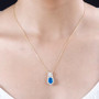 neon blue apatite and moissanite pendant necklace in 18k yellow gold over sterling silver worn around the neck