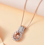 morganite and moissanite pendant necklace in 18k rose gold over sterling silver shown in a lifestyle photo