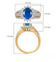 neon blue apatite and moissanite ring in 18k yellow gold over sterling silver shown for size comparison