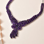 amethyst butterfly cluster necklace in rhodium over sterling silver shown in a lifestyle photo