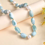 larimar and pearl beaded necklace in 18k yellow gold over sterling silver shown in a lifestyle photo