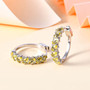 yellow apatite and white zircon hoop earrings in rhodium over sterling silver shown in a lifestyle photo