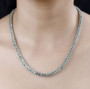 green apatite and white zircon tennis necklace in rhodium over sterling silver worn around the neck