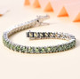 green apatite and white zircon tennis bracelet in rhodium over sterling silver shown in a lifestyle photo