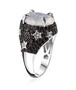 side view of rainbow moonstone black spinel and white zircon star ring in black and white rhodium over sterling silver