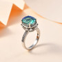 blue and green quartz triplet and white zircon ring in rhodium over sterling silver shown in a lifestyle photo