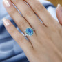 blue and green quartz triplet and white zircon ring in rhodium over sterling silver worn on a hand