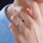 moissanite chevron band ring in 18k yellow gold over sterling silver worn on a hand