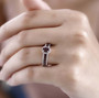 anthill garnet and white zircon two ring set in 18k rose gold over sterling silver worn on a hand