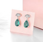 close up of green fluorite and zircon fan drop earrings in rhodium over sterling silver