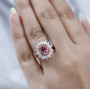 pink tourmaline opal and pink sapphire halo cluster ring in 18k rose gold over sterling silver worn on a hand