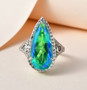pear blue and green quartz triplet blue apatite and zircon ring in rhodium over sterling silver shown in a lifestyle photo