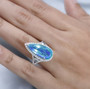 pear blue and green quartz triplet blue apatite and zircon ring in rhodium over sterling silver worn on a hand