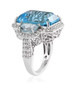 side view of sky blue topaz and white zircon three stone halo ring in rhodium over sterling silver