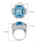sky blue topaz and white zircon three stone halo ring in rhodium over sterling silver shown for size comparison