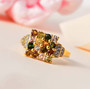 multi color tourmaline and white zircon cluster ring in 18k yellow gold over sterling silver shown in a lifestyle photo
