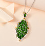 chrome diopside cluster pendant necklace in 18k yellow gold and rhodium over sterling silver shown in a lifestyle photo