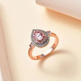 pink spinel pink sapphire and white zircon ring in 18k rose gold over sterling silver shown in a lifestyle photo