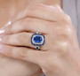 kyanite iolite and moissanite halo ring in rhodium over sterling silver worn on a hand