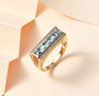 swiss blue topaz and white zircon gents ring in 18k yellow gold over sterling silver shown in a lifestyle photo