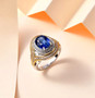 kyanite and white zircon ring in 18k yellow gold and rhodium over sterling silver shown in a lifestyle photo